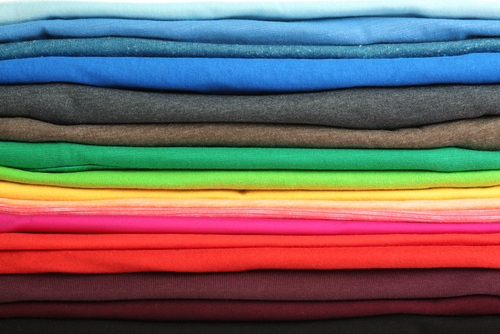 closeup stack of folded t shirts