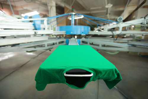 green t shirt on silk screen printing machine