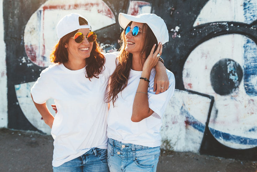 happy women in short sleeve shirts