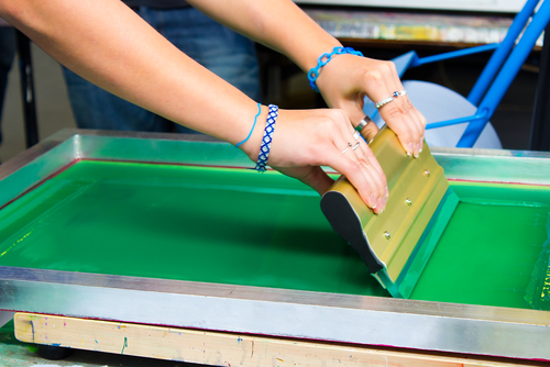 Printer Making T-Shirt By Screen Print Technique