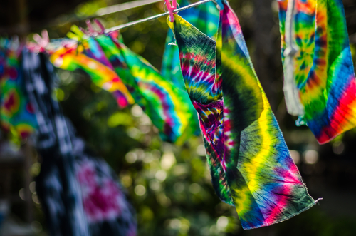 tie dye apparel hanging on clothesline