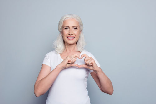 woman signing heart