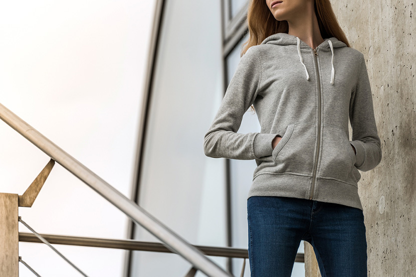 Woman wearing blank grey hoodie