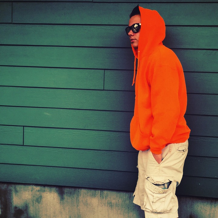 Young man wearing orange hoodie