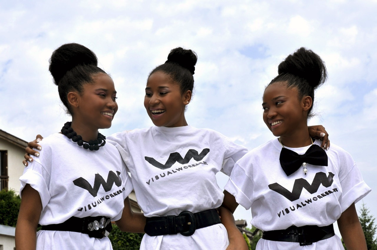 Three girls in white t-shirts